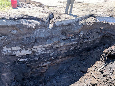 Technology in archaeology records a section of the old Erie Canal stone wall, dating back to the mid-1800's, is visible in a large hole dug by heavy equipment.